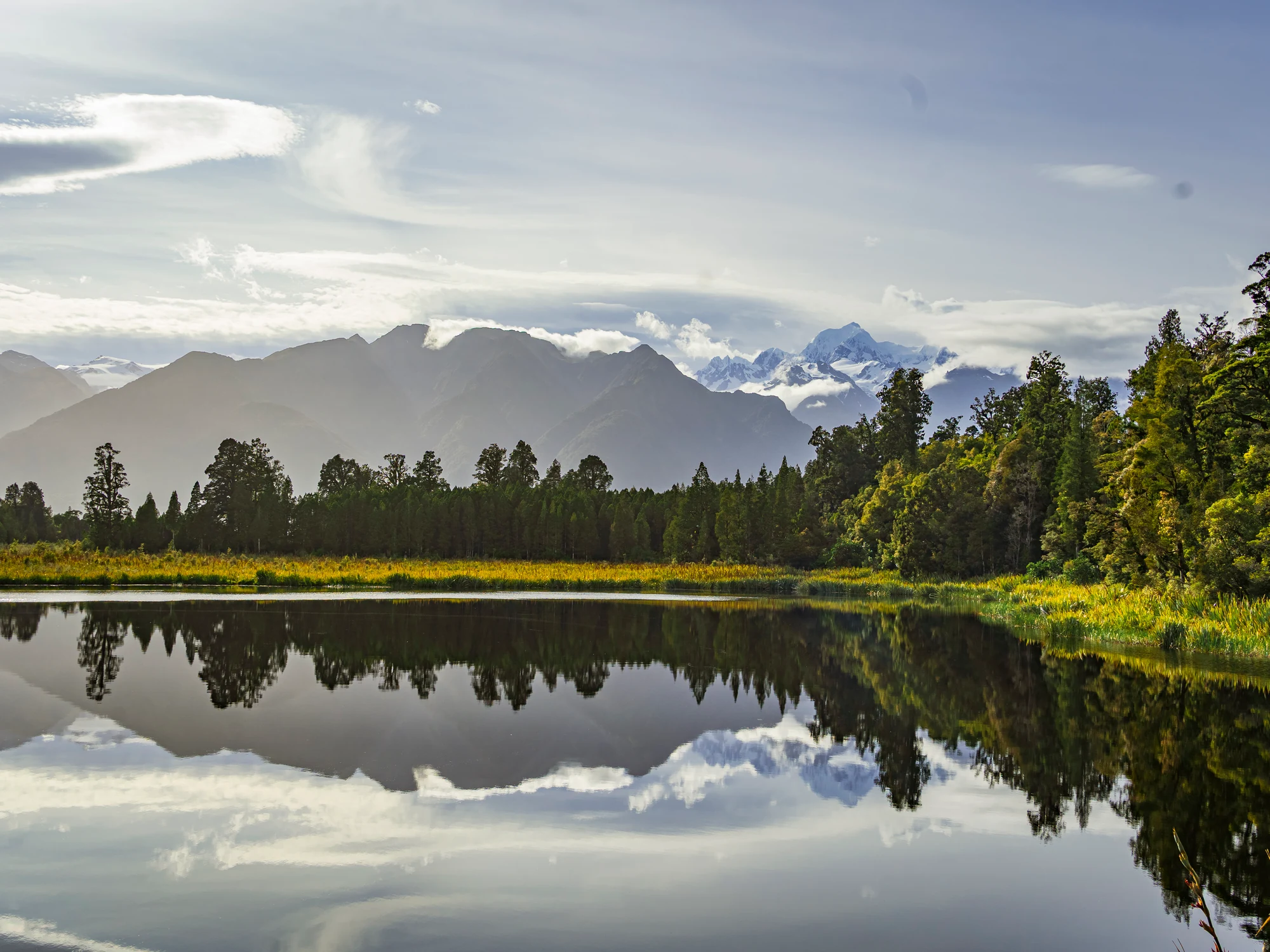 A mirrored alpine lake beneath the Southern Alps