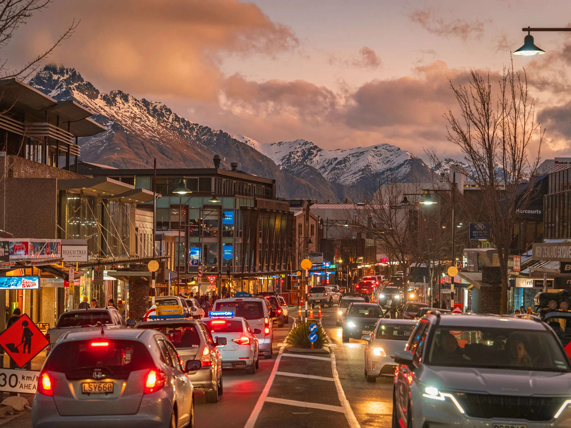 Queenstown street under pink sunset clouds