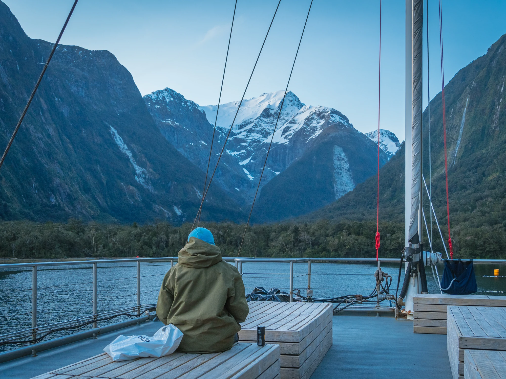 Cruising Milford Sound beneath snowy peaks